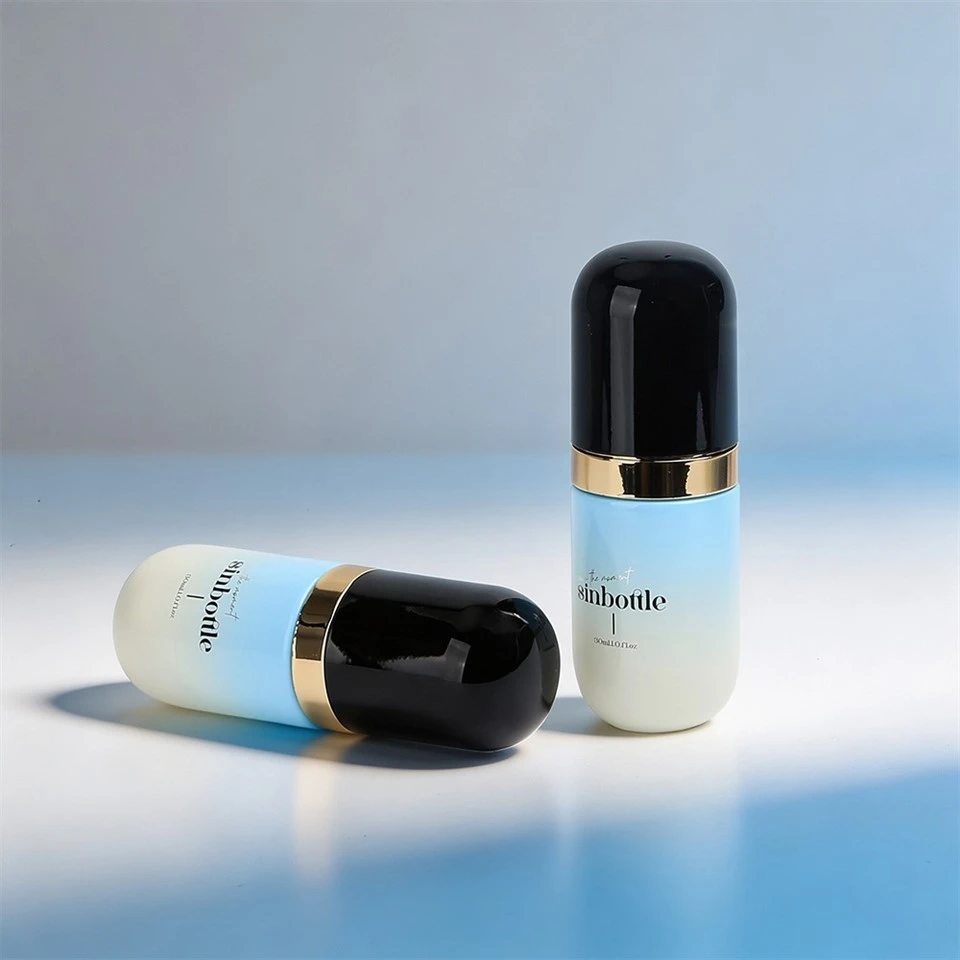 30ml Luxury Capsule Shaped Gradient Blue Glass Foundation Lotion Bottle With Black Cap And Gold Pump factory