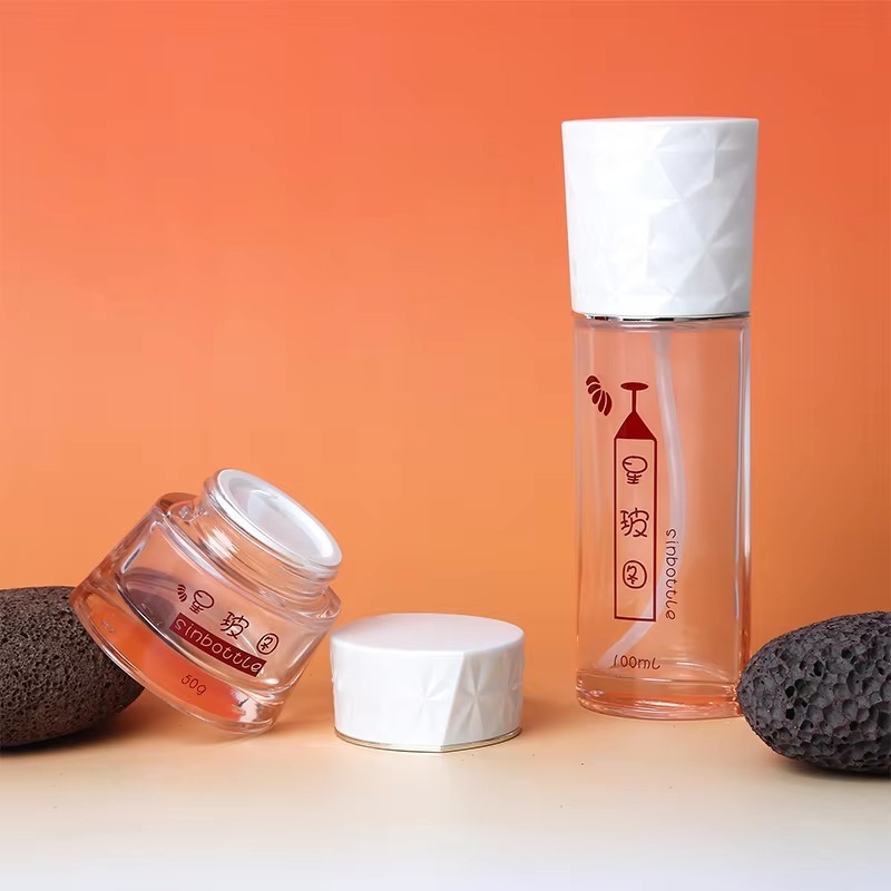 Luxury 50ml 100ml Round Glass Bottles Set For Face Cream Lotion Empty Spray Bottle With Airless Pump Custom Cosmetic Packaging high quality
