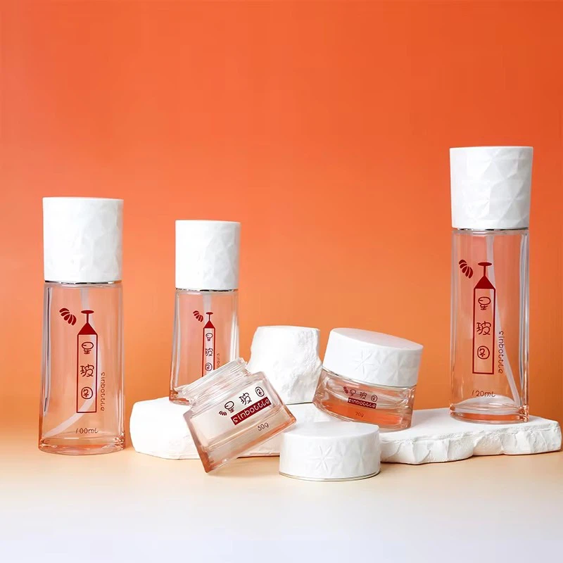 Luxury 50ml 100ml Round Glass Bottles Set For Face Cream Lotion Empty Spray Bottle With Airless Pump Custom Cosmetic Packaging